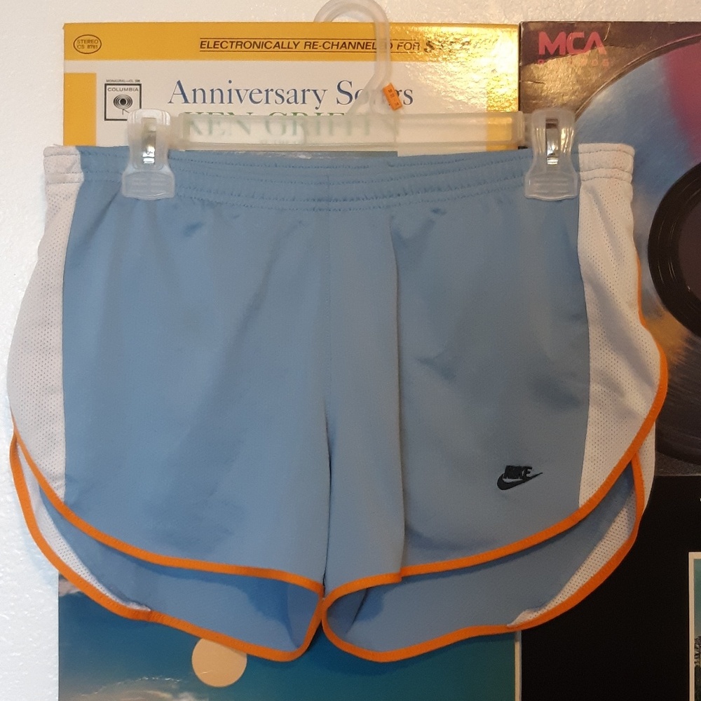 Baby blue Nike running shorts.
